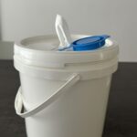 Refillable Plastic Bucket for Industrial Wipes This durable plastic bucket is designed to hold dry rolls of wipes, which can be soaked with your own cleaning or disinfectant solution to create industrial wet wipes. The refillable design ensures cost savings and flexibility, while the sealed lid keeps wipes fresh and ready for use.  Ideal for factories, workshops, automotive, and maintenance industries.