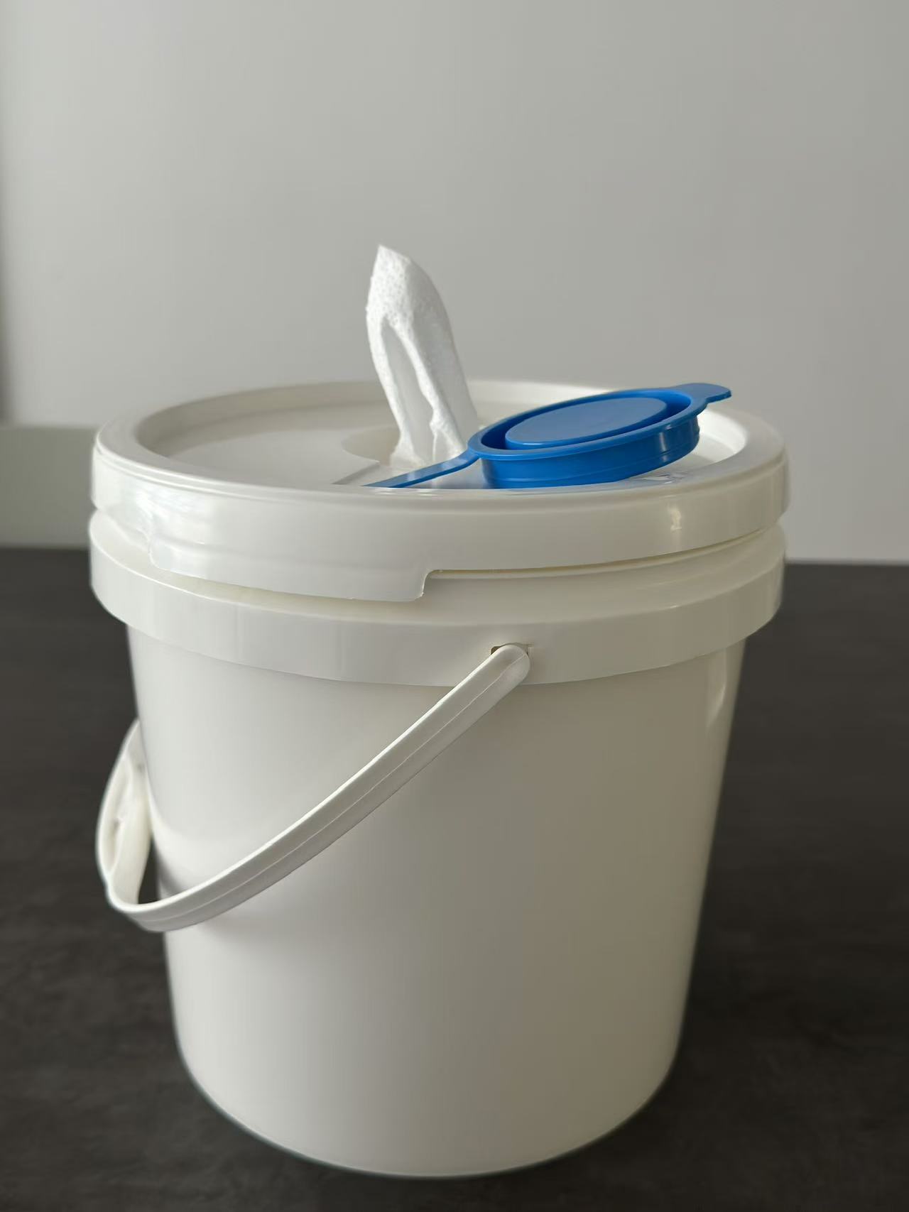 Refillable Plastic Bucket for Industrial Wipes This durable plastic bucket is designed to hold dry rolls of wipes, which can be soaked with your own cleaning or disinfectant solution to create industrial wet wipes. The refillable design ensures cost savings and flexibility, while the sealed lid keeps wipes fresh and ready for use.  Ideal for factories, workshops, automotive, and maintenance industries.